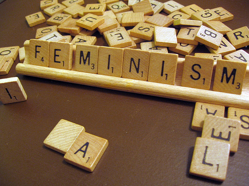 Photo of scrabble tiles forming the word "FEMINISM"